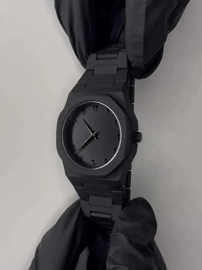 Black Arabic Aura watch on wrist